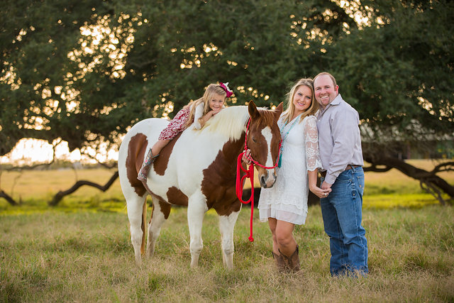 daughter on horse at engagement session
