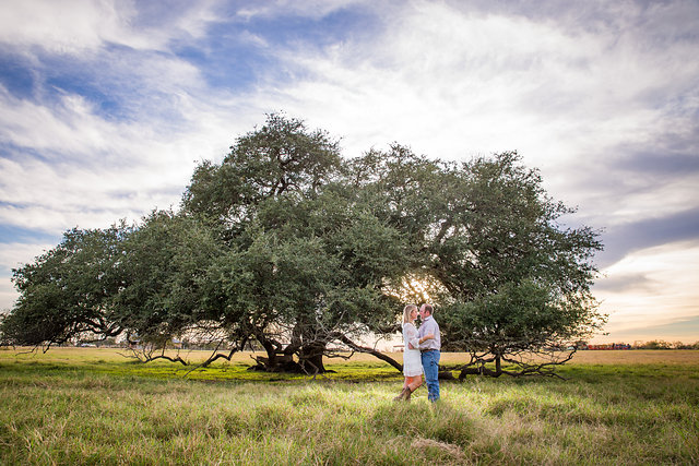 Couple Standing in field at san antonio engagement session