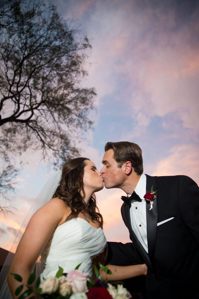 Ashley and Josh's wedding sunset kiss