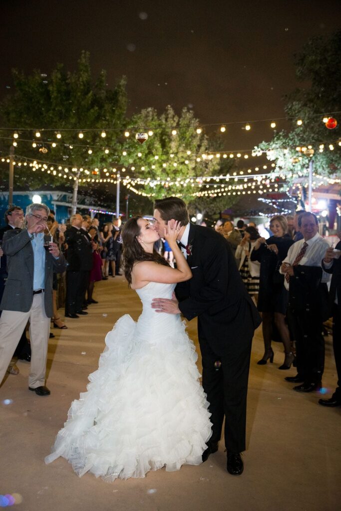 Ashley - Josh's wedding carousel exit kiss