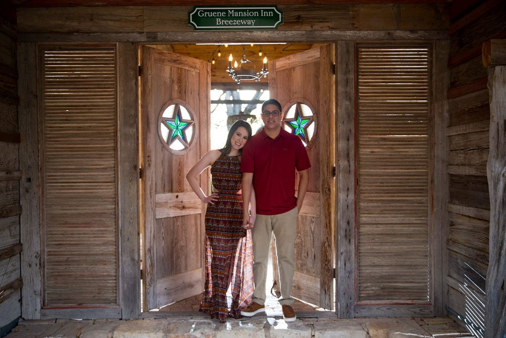 Aamber and Alex engagement session in Gruene Tx breezeway doors front