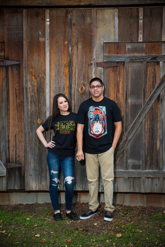 Aamber and Alex engagement session in Gruene Tx wood wall tee shirt