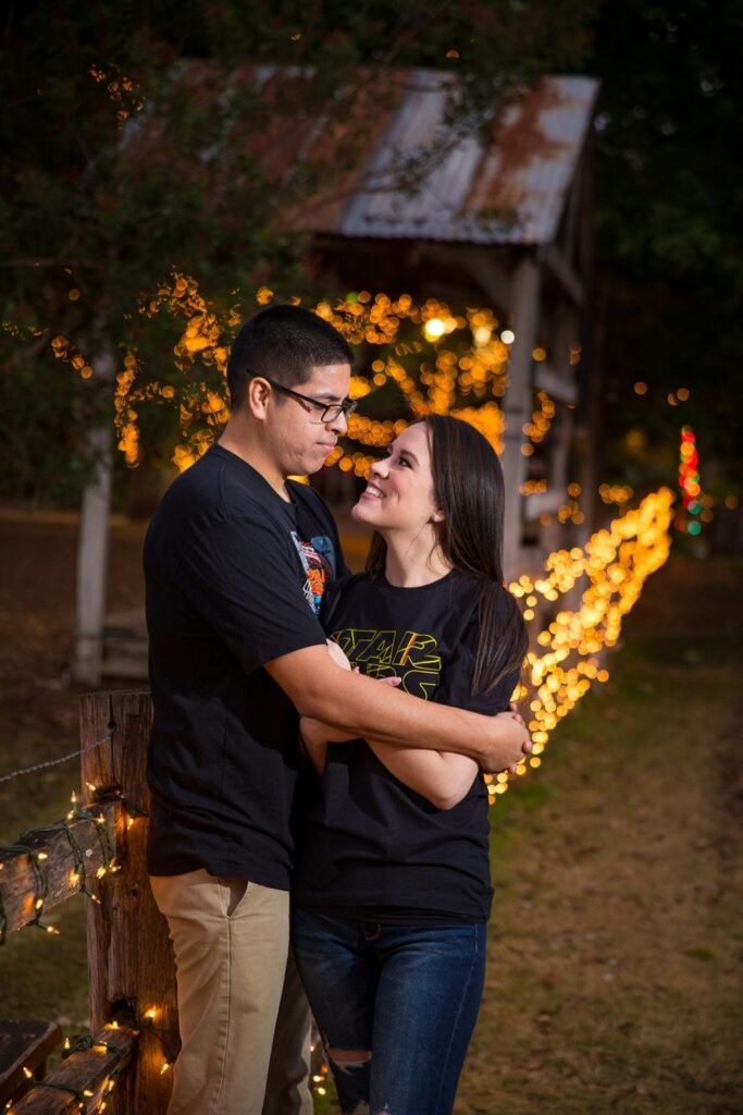 Aamber and Alex engagement session in Gruene Tx Christmas lights