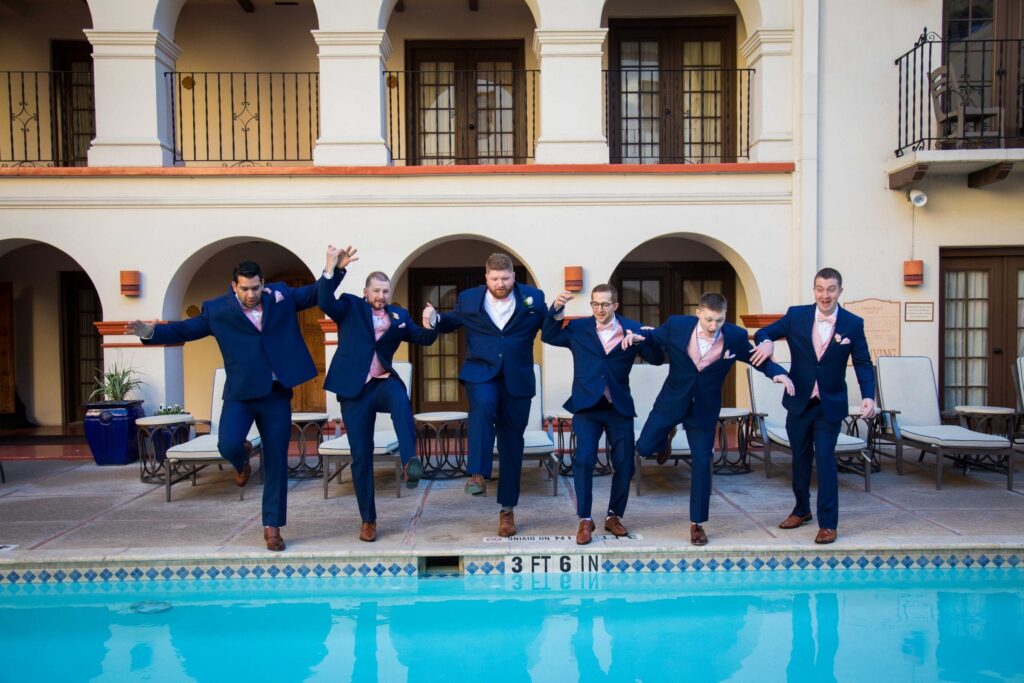 Crawford wedding Omni Del Mansion riverwalk groomsmen in pool