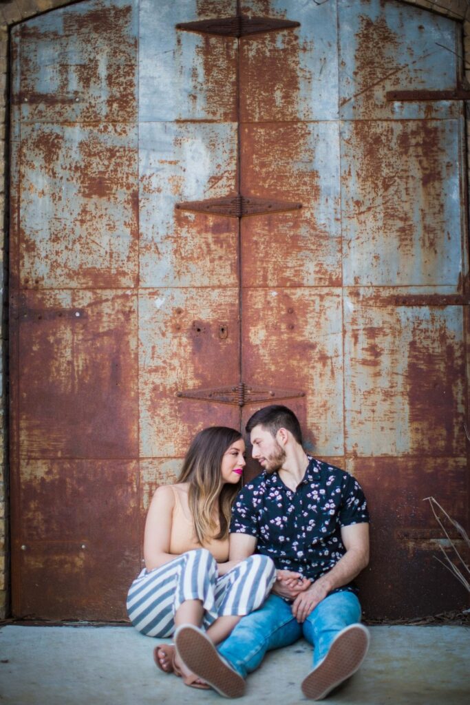 Liz and Ruben engagement rusted wall close up downtown New Braunfels