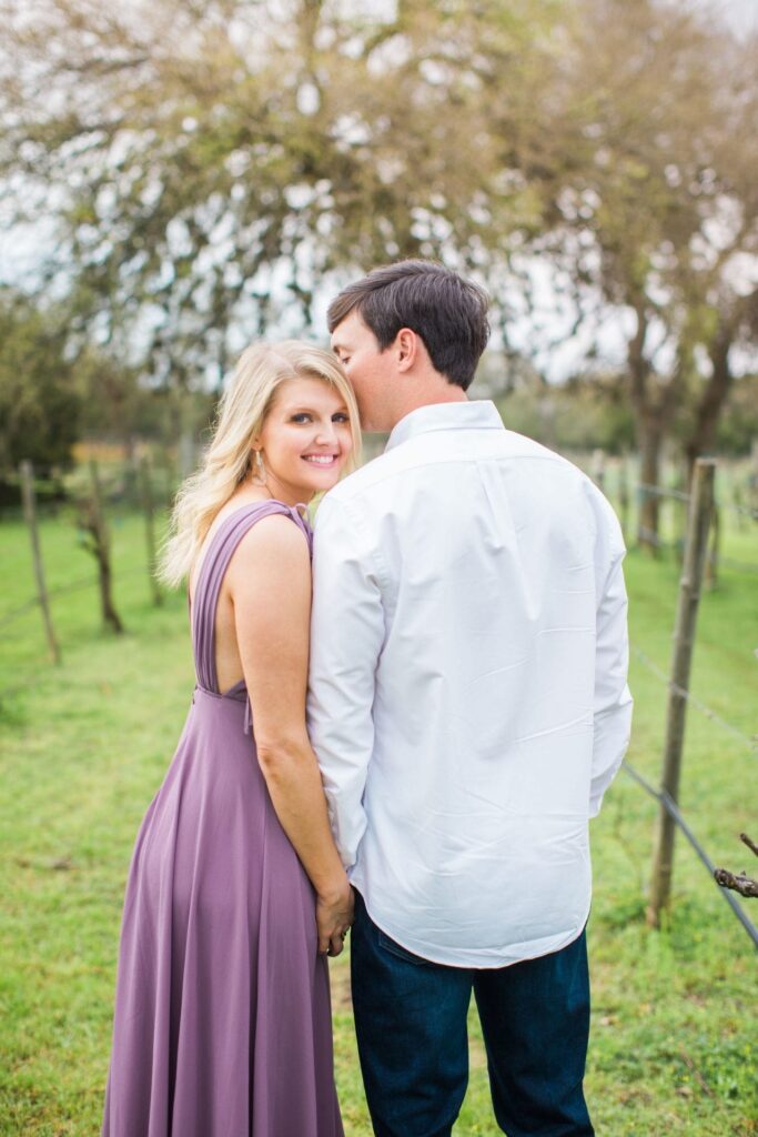Michele Engagement session at Oak Valley Vineyards looking back purple dress