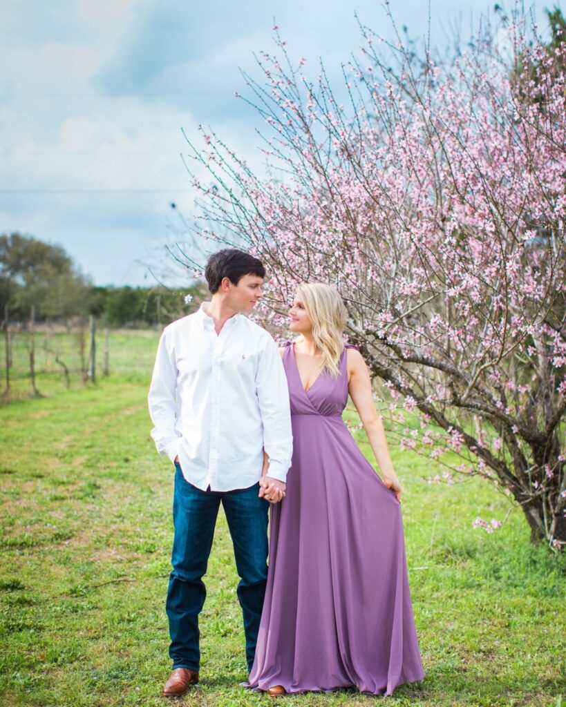 Michele Engagement session at Oak Valley Vineyards in front of pink flowers