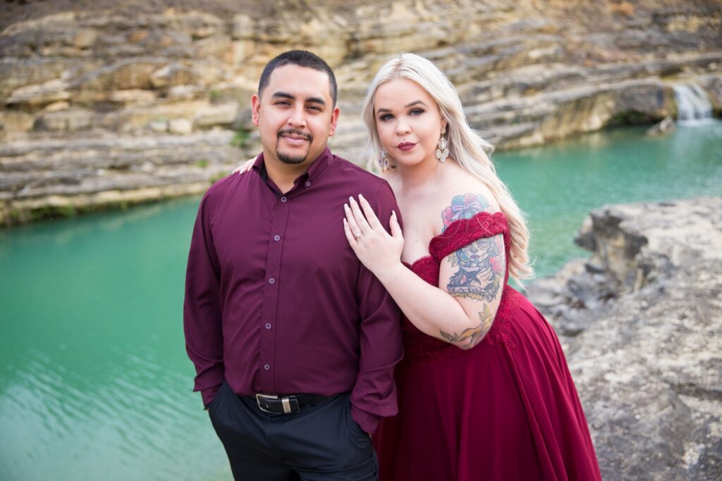 Katie and Gabe engagement session Canyon Lake dam gorge on rocks portrait