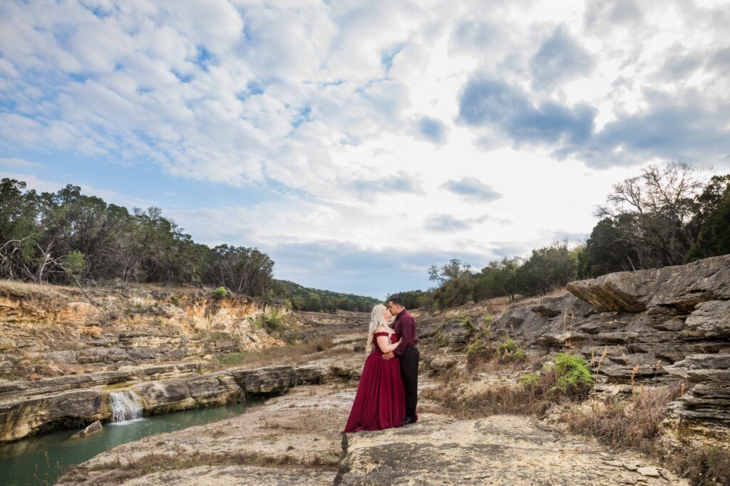 Katie and Gabe engagement session Canyon Lake dam gorge on rocks full sky