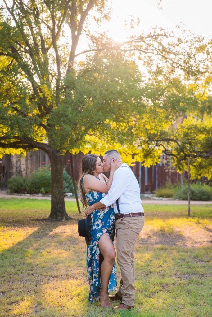 Ashley and Andy's engagement session Gruene trees kiss