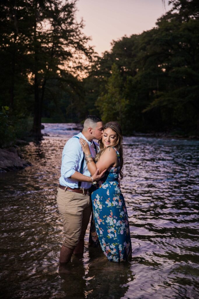 Ashley and Andy's engagement session Gruene river sunset hug