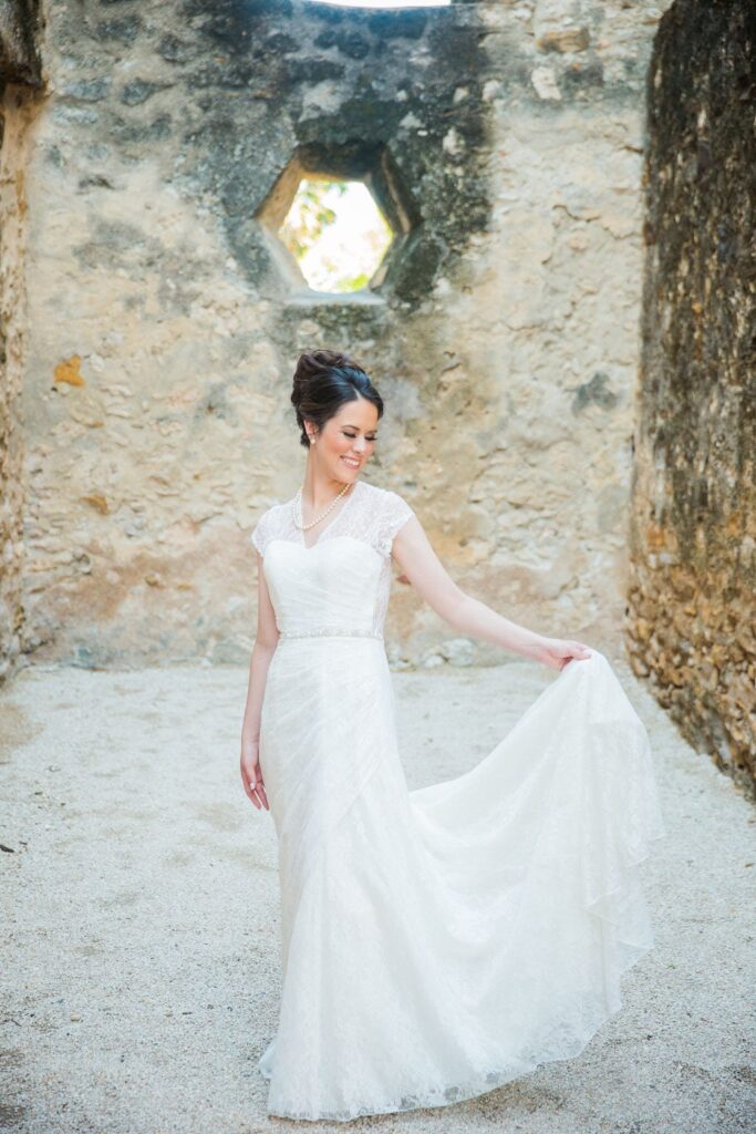 Aamber's bridal - mission San Jose holding dress light and airy