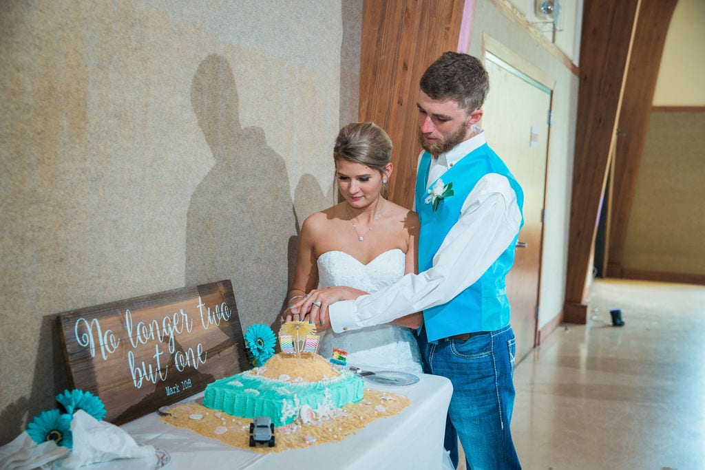 Courtney and Bearen's Wedding grooms cake feeding