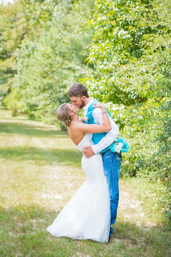 Courtney and Bearen's Wedding. Aa dip kiss in the trees