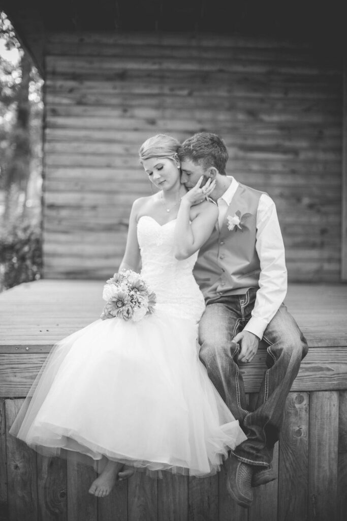 Courtney and Bearen's Wedding couple on wood romance
