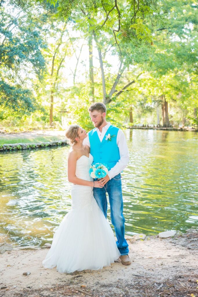 Courtney and Bearen's Wedding couple by pond