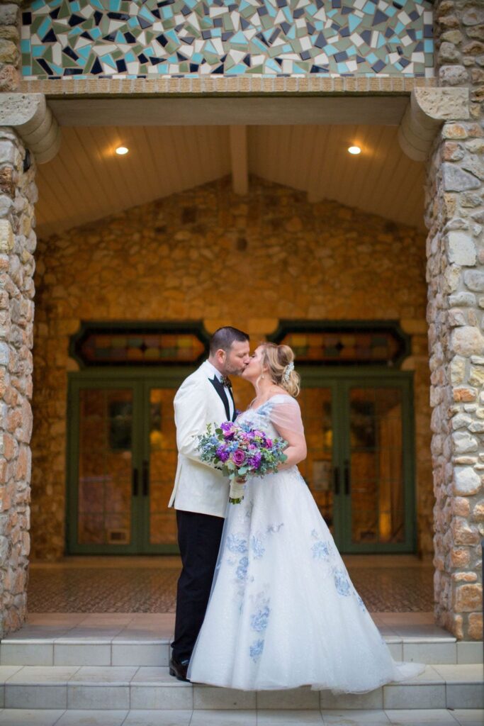 Lisa and Michael Wedding at the Veranda. Kissing in door way
