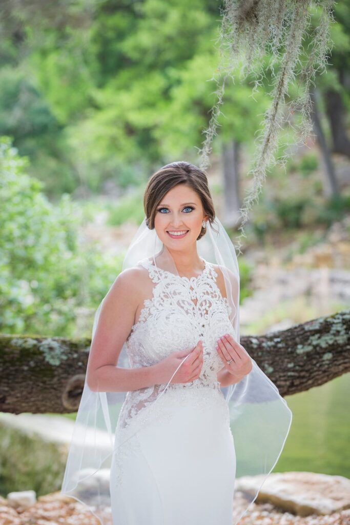 Samantha's Bridal Hidden Falls back of gown under the tree close up smiling