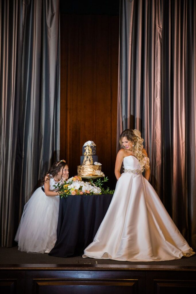 St Anthony Styled wedding cake with bride and flower girl