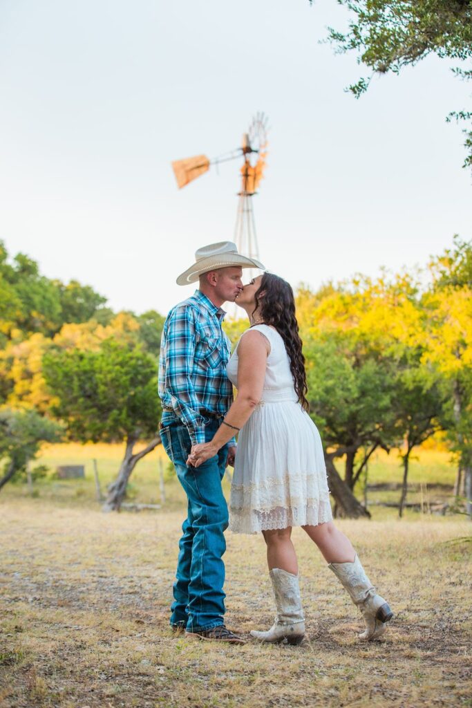 Tess -Lance Boerne, TX Engagement Portrait kiss by windmill