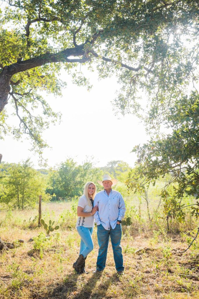 Whitney and Craig's ranch Engagement session under the tree