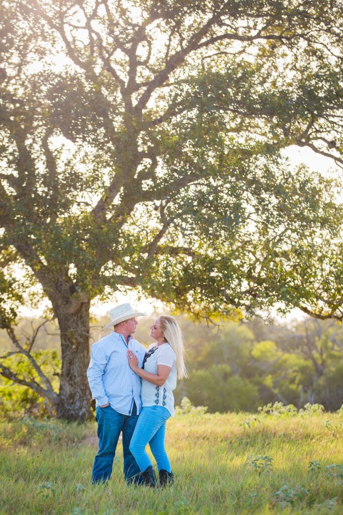 Whitney and Craig's ranch Engagement session dreamy at the tree
