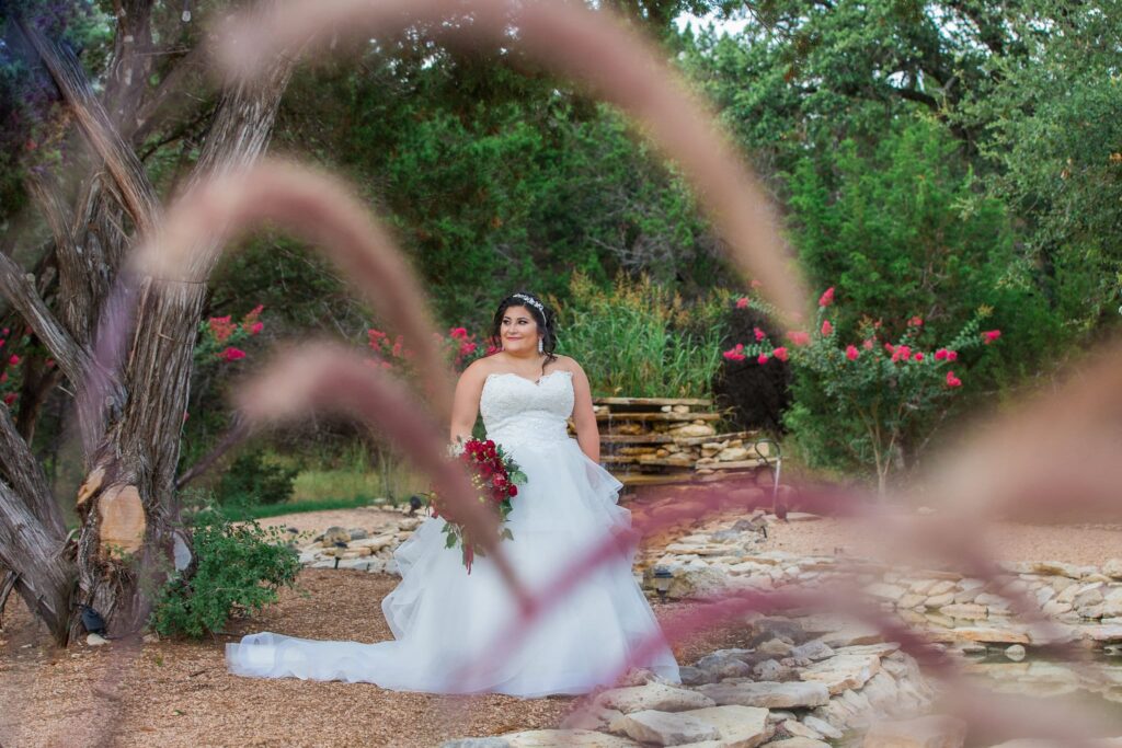 Laura's Bridals at Western Sky at the fountain through the grass