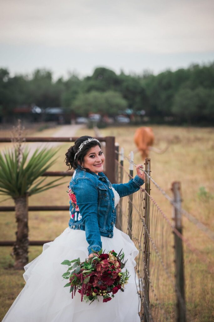 Laura's Bridals at Western Sky in the field at the gate