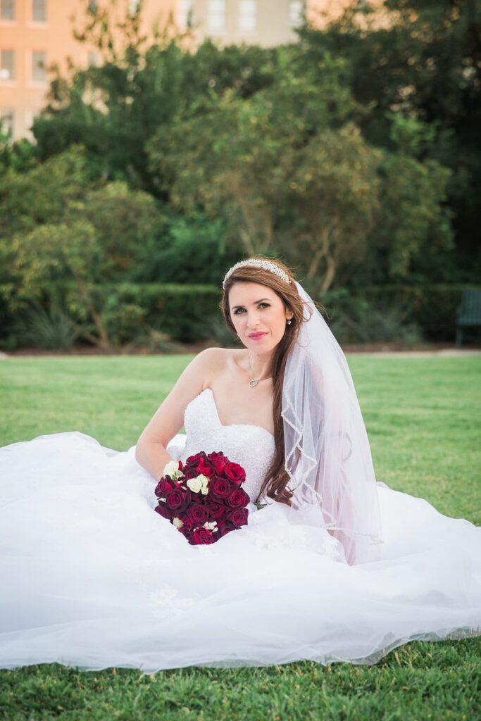 Laura's bridal at Landa Library sitting in the grass