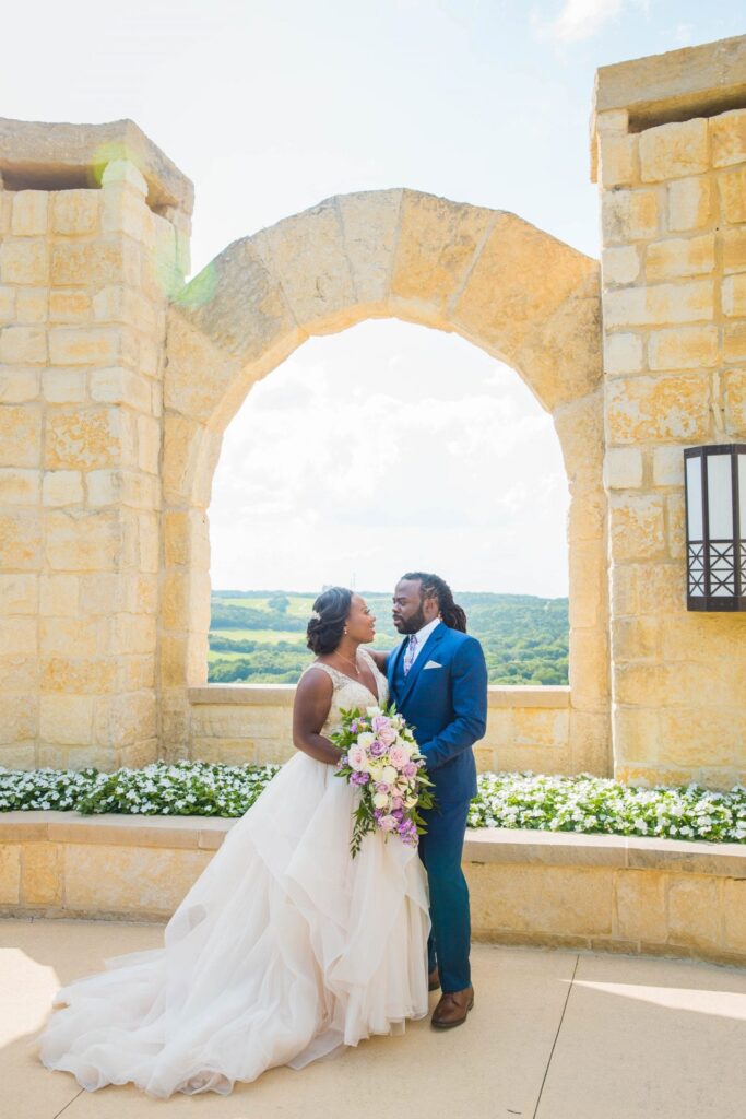 Onyema wedding La Cantera arches looking at each other