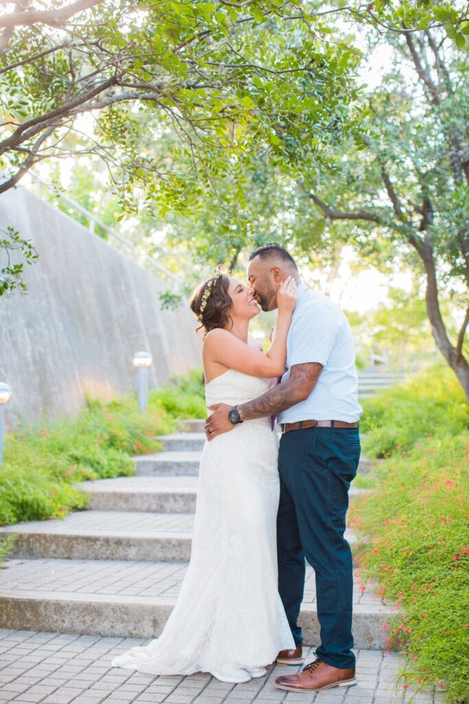 Courtney Amaya wedding San Antonio Botanical Garden couple on the stairs kissing