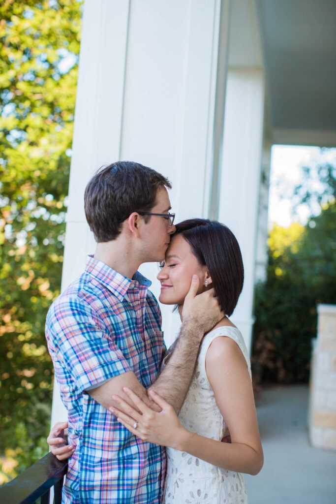 Josh and Tina engagement session at Kendall plantation kiss on the porch
