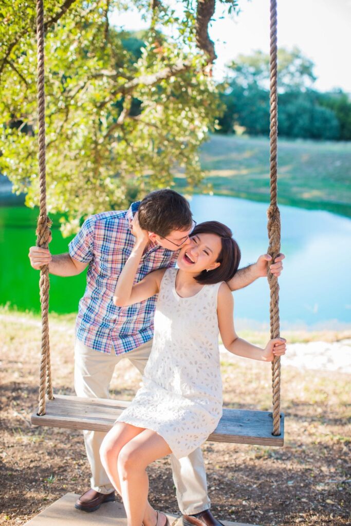 Josh and Tina engagement session at Kendall plantation sitting on swing