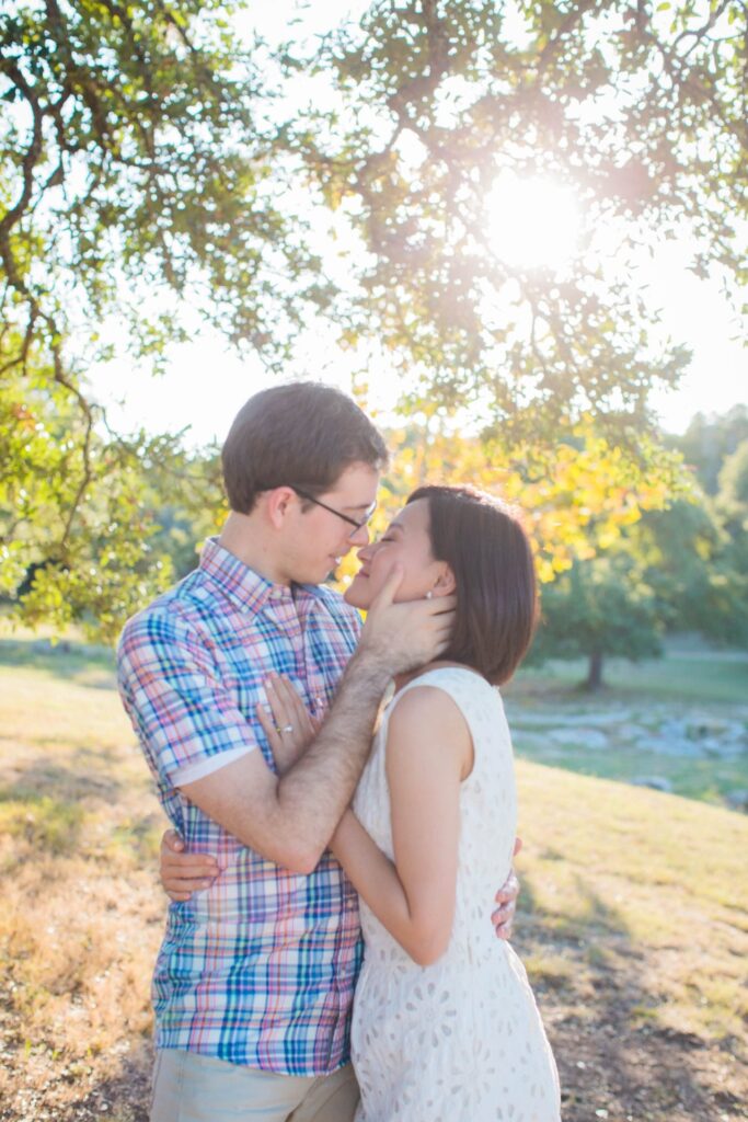 Josh and Tina engagement session at Kendall plantation kiss under tree
