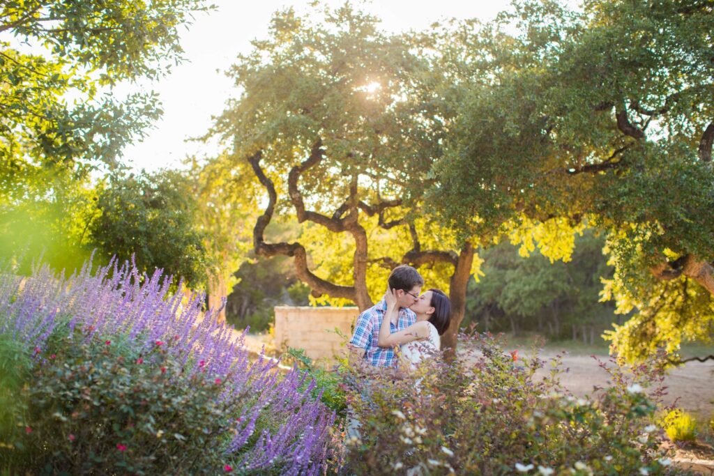 Josh and Tina engagement session at Kendall plantation kiss in the garden