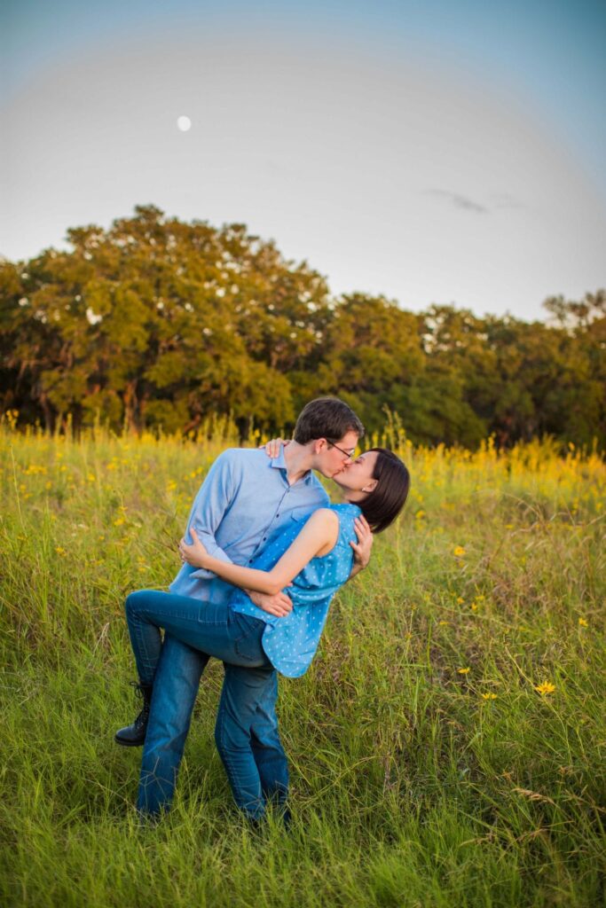 Josh and Tina engagement session at park in tall grass dip