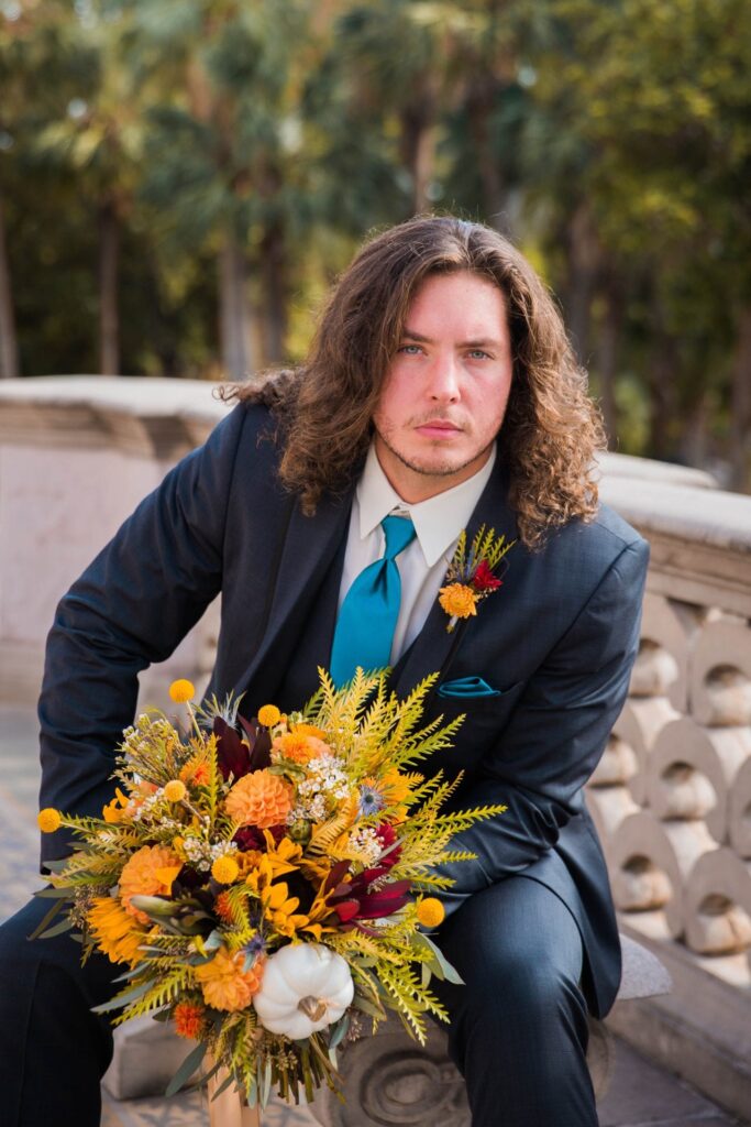 Fall styled shoot at the McNay art museum groom with flowers