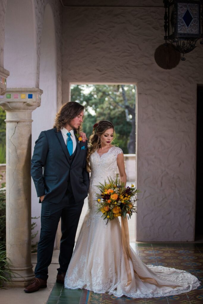 Fall styled shoot at the McNay art museum couple in arches looking down
