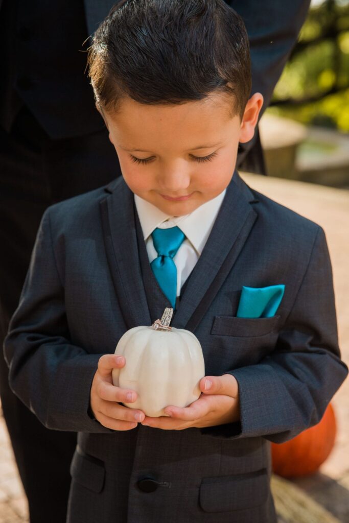 Fall styled shoot at the McNay art museum kid with pumpkin