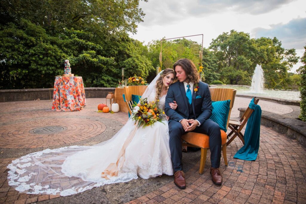 Fall styled shoot at the McNay art museum couple seated at fountain