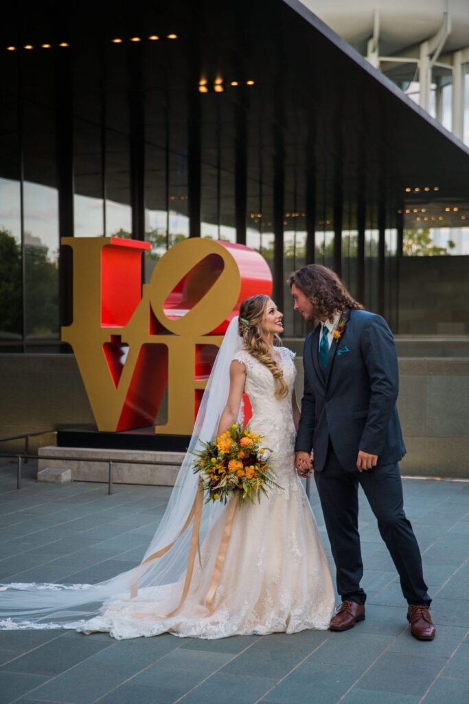 Fall styled shoot at the McNay art museum couple at LOVE letters close