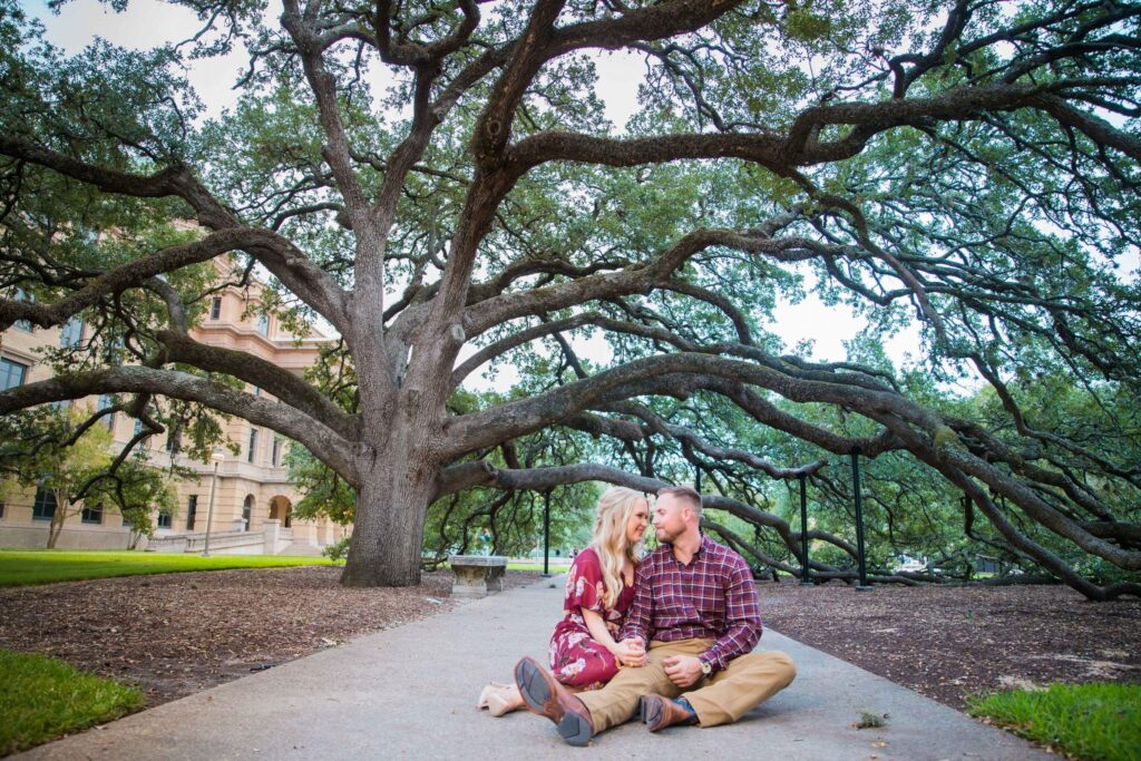 Molly's engagement Texas a and M under the century tree sitting