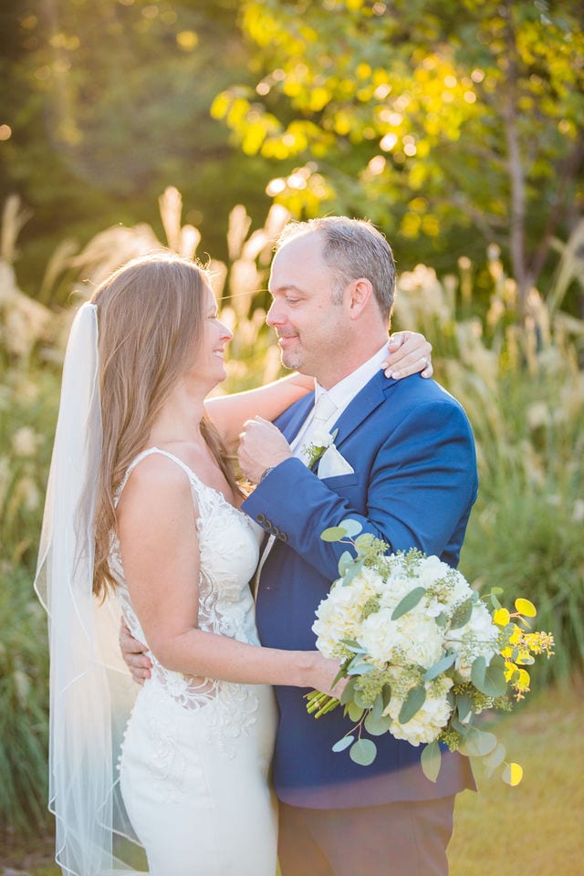 David and Angie wedding at The Kendall Inn bride and groom by pampas grass romance