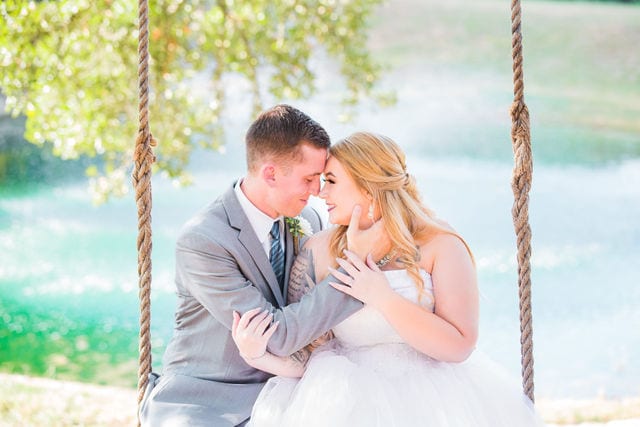 Kristina and Brandon's Wedding close up on the swing at Kendall Plantation