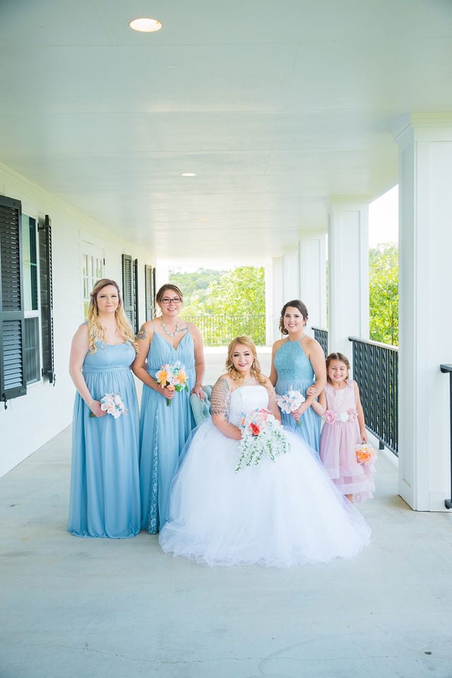 Kristina and Brandon's Wedding bridesmaids on the porch at Kendall Plantation
