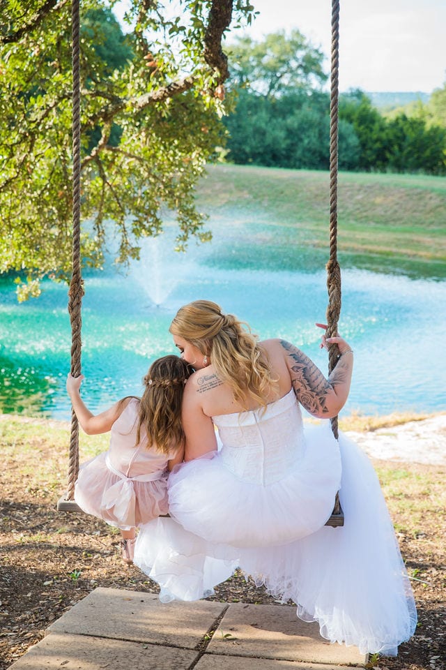 Kristina 's Wedding with flower girl on the swing at Kendall plantation