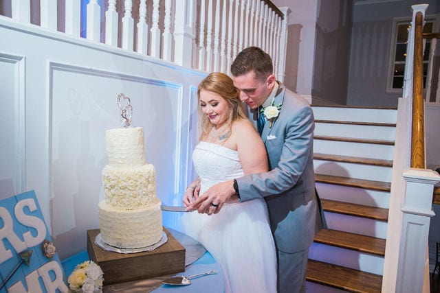 Kristina and Brandon's Wedding at Kendall plantation cake cutting