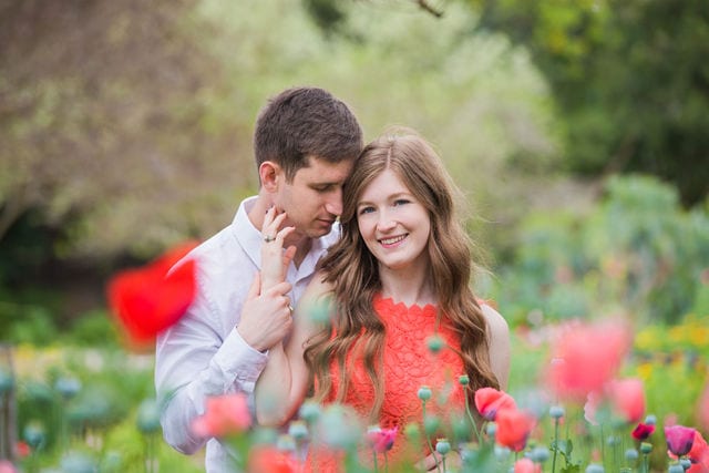 Claire & Josh engagement session San Antonio Botanical Gardens in the poppies being sweet