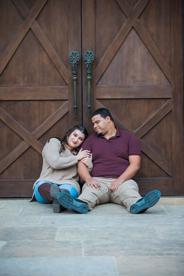 Dana and Andrews engagement session at the Pearl Stable doors laughing