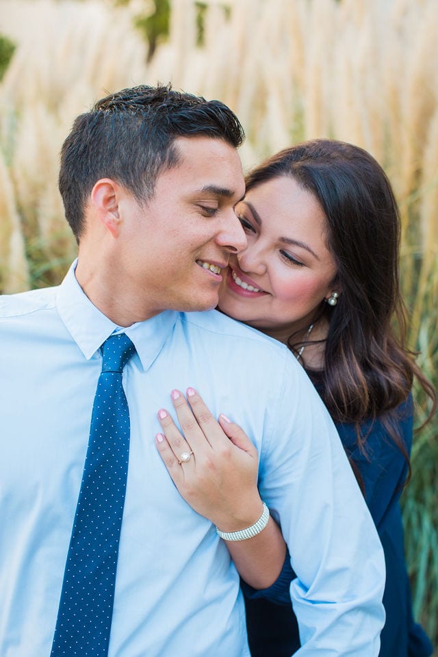 Anthony Engagement session at La Cantera Resort in front of the pampas grass kissing